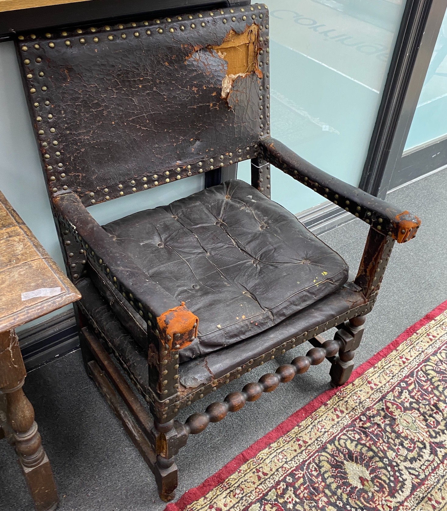 A near pair of 18th century oak and leather dining chairs, larger 69cm, depth 64cm, height 101cm